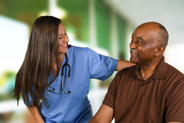 Health care worker helping an elderly patient